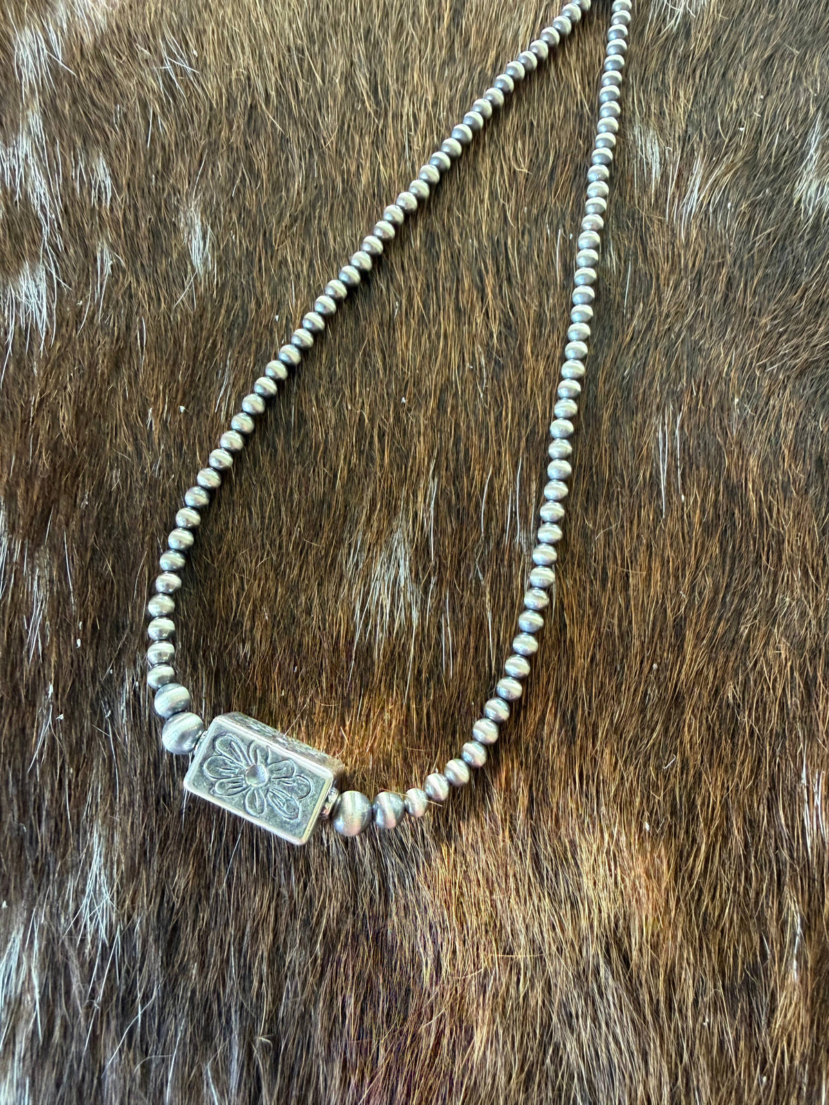 Sterling Flower stamped barrel bead necklace 
